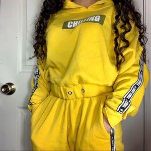 yellow jumpsuit “chillin”